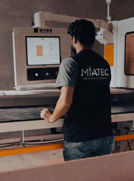 Miatec technician operating CNC machinery in the Riyadh joinery factory