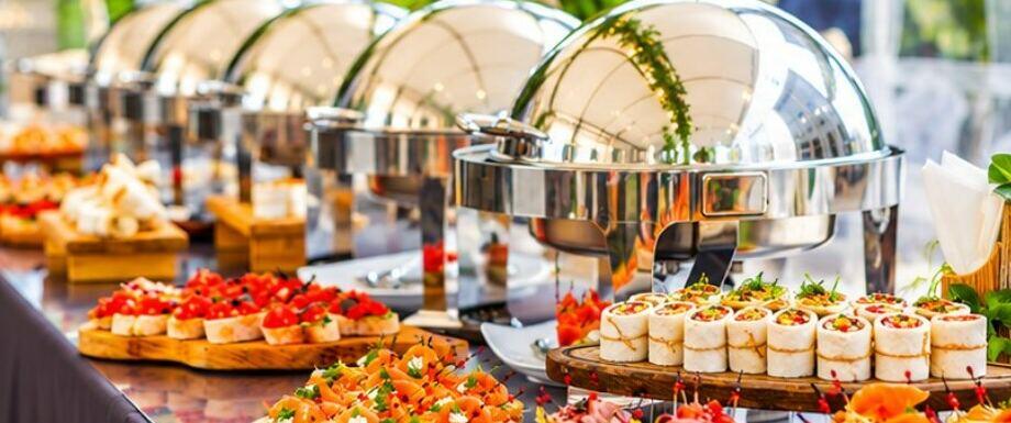Hot food station with silver chafing dishes
